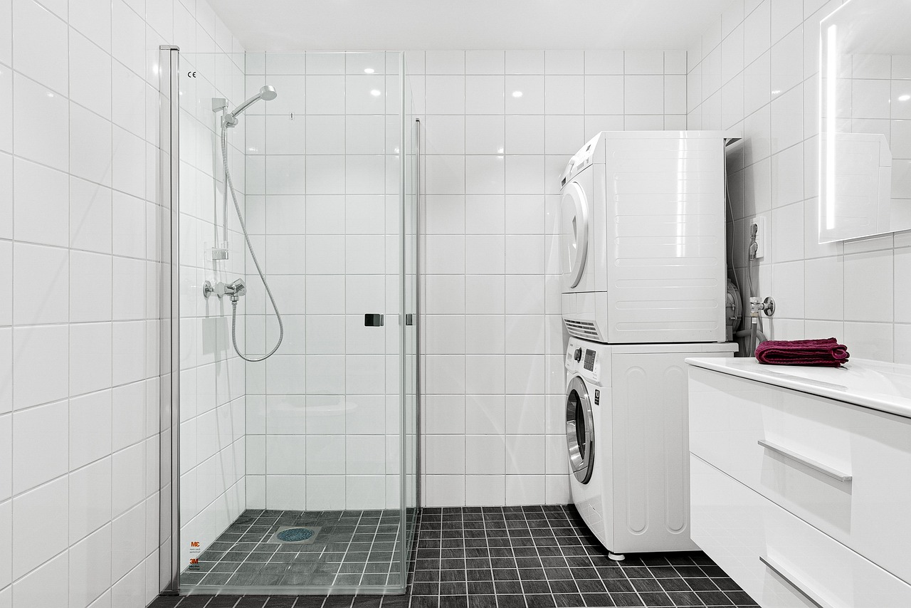 Laundry equipment in a clean bathroom setting